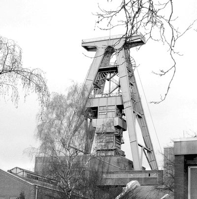 The photo shows an old winding tower.
